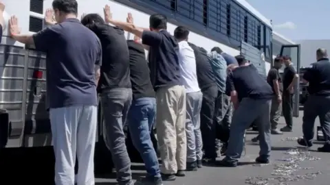 Georgia Factory Raid Highlights Immigration Confusion Amidst Electric Vehicle Boom