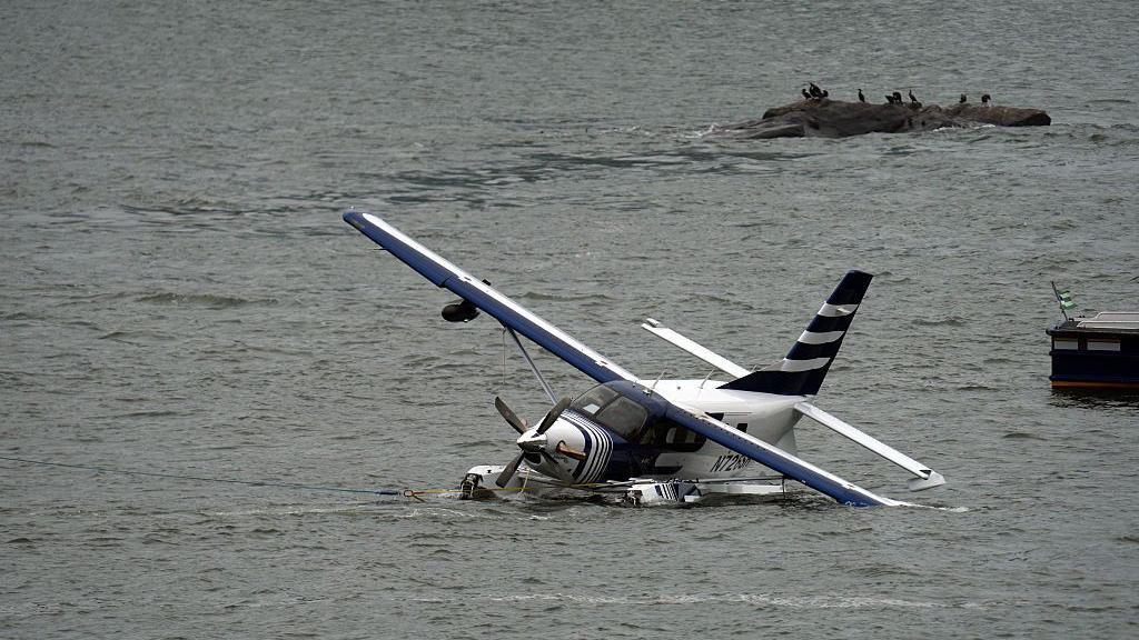Emergency services respond to a crashed seaplane in the East River