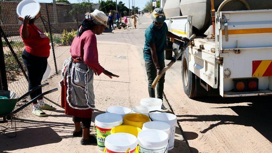 Residents wait for water tankers near Pretoria