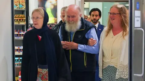 British Couple Freed from Taliban Detention Returns to the UK