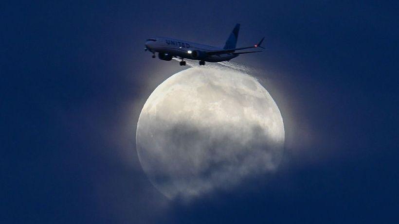 Hunter’s Moon over Manhattan city skyline