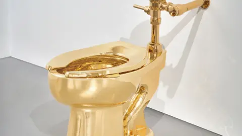 Ripley's Acquires $12 Million Golden Toilet Amidst Historic Auction